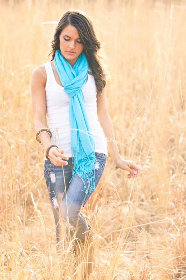 Country Girl Walking Through A Field